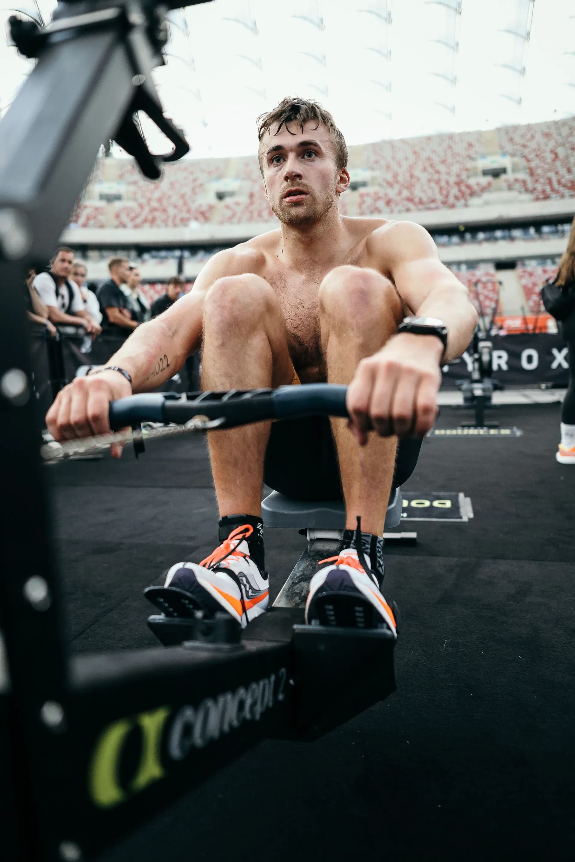 Richard Hynek on the Concept2 rower during a HYROX race